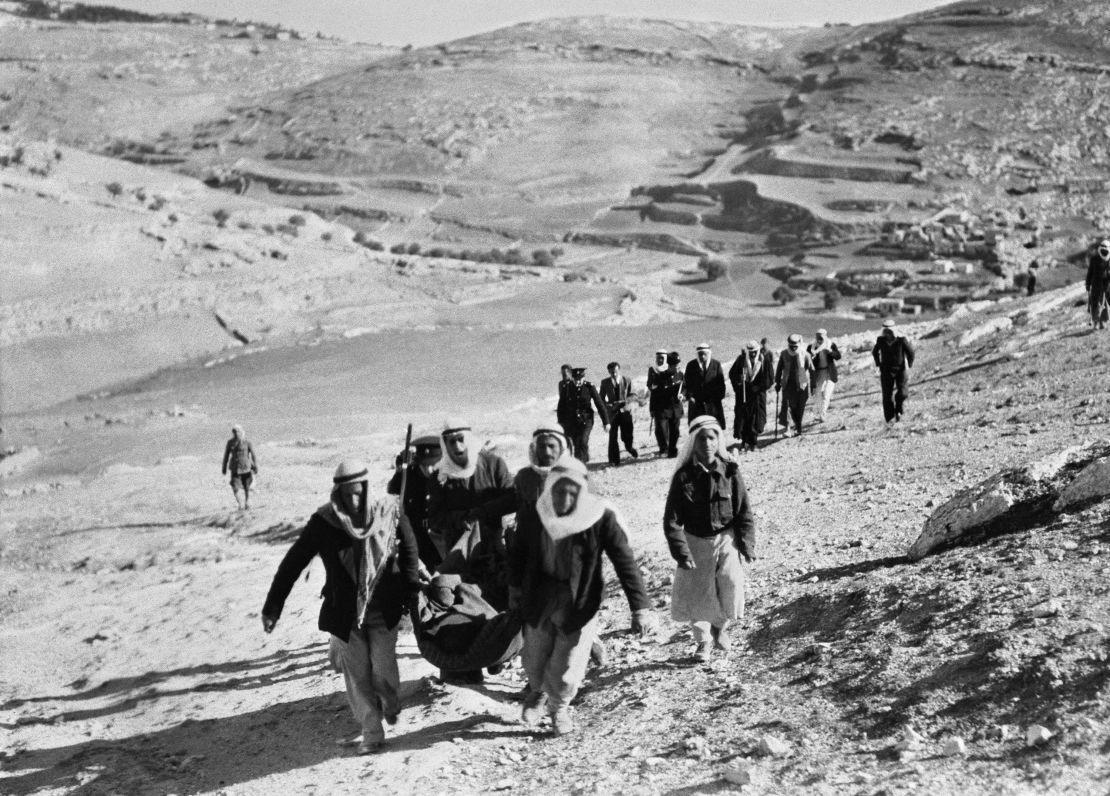 Picture released in January 1948 shows Palestinian Arabs leaving their village and neighborhoods of Jerusalem to march against a Jewish settlement in Palestine and fleeing the Haganah attack, during the 1948 ArabIsraeli War. On November 29, 1947, the United Nations' General Assembly voted resolution 181 on the partition of Palestine in two states, one Jewish and one Arab. Jerusalem was to remain under international control. The State of Israel was proclamed on 14 May 1948 by the Jewish National Council and was recognized by the United States and the Soviet Union 15 and 17 May the same year. Arab States of Lebanon, Syria, Jordan, Egypt and Iraq crossed the borders from north, east and south with their regular armies 15 May 1948. Agreements signed in 1949 between Israel and the Arab States ended the 1948 Arab-Israeli War, and established the armistice lines between Israel and the West Bank, also known as the Green Line, until the 1967 Six-Day War. (Photo by INTERCONTINENTALE / AFP) (Photo by -/INTERCONTINENTALE/AFP via Getty Images)