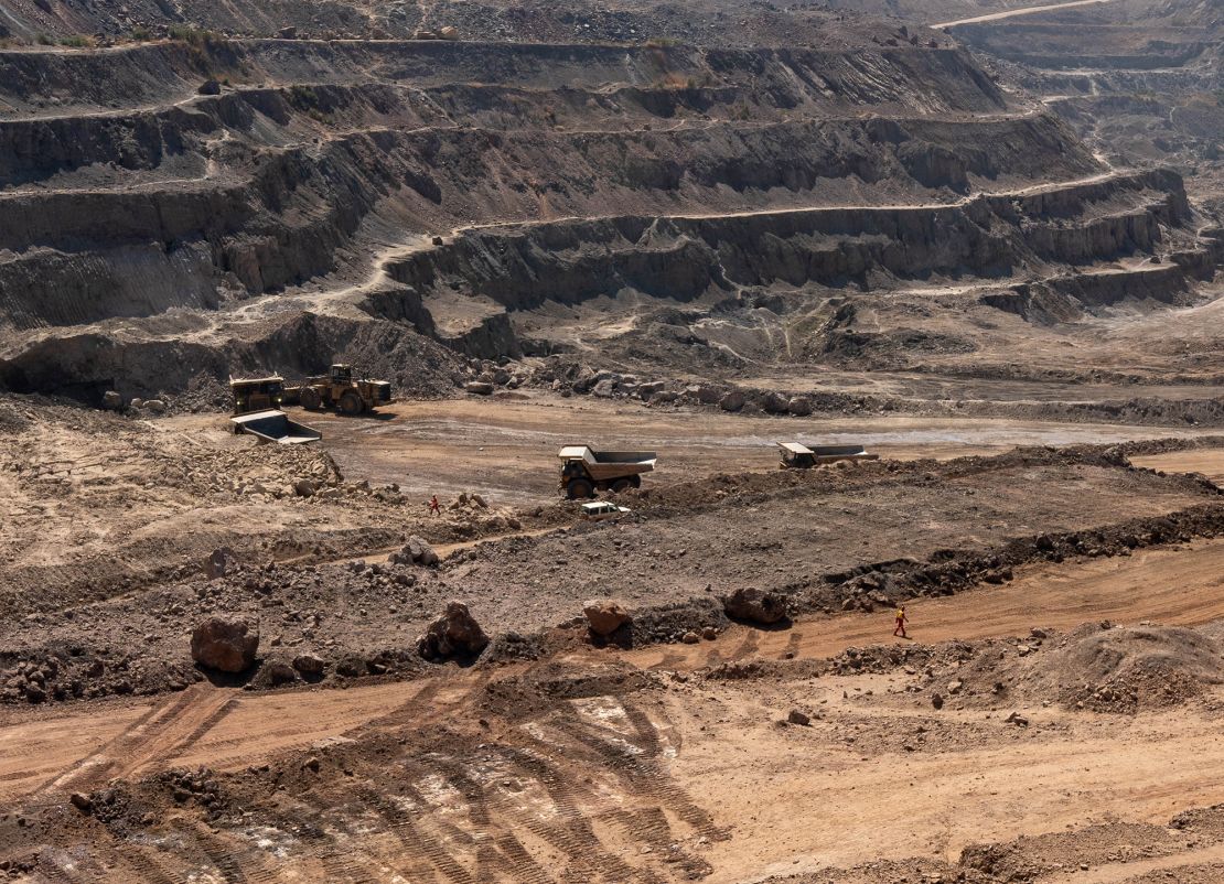 Trucks haul away ore from a pit in Tenke Fungurume Mine, one of the largest copper and cobalt mines in the world, mostly owned by Chinese company CMOC, in southeastern Democratic Republic of Congo, on June 17, 2023.