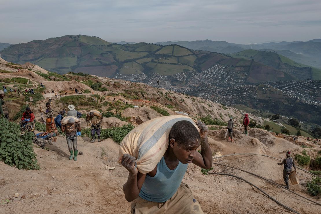 Miners work to extract coltan at a mine, near Rubaya, in DR Congo's North Kivu region, on April 12, 2023.