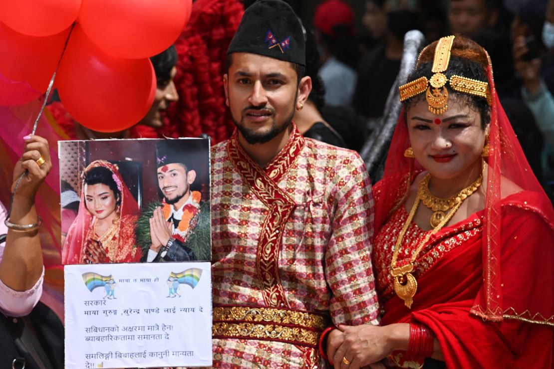 Nepali same-sex couple Maya Gurung and Surendra Panday take part in a Pride Parade in Kathmandu on August 31, 2023.