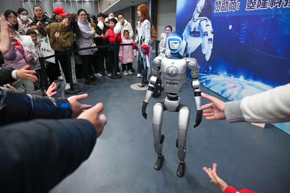 A humanoid robot entertains the crowd at a robotics exhibition in eastern China's Nanjing last month.