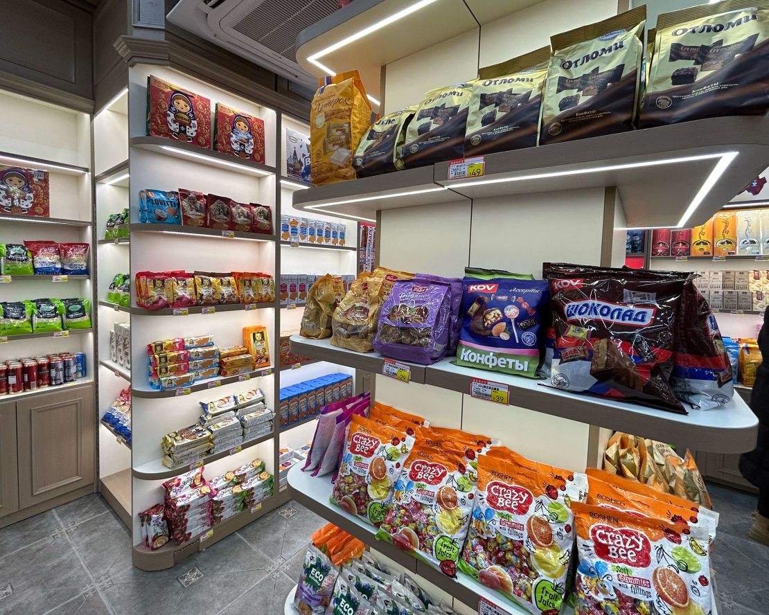 A variety of Russian chocolates and biscuits are displayed at a Russian goods store in Beijing on December 29. There are also some products on the shelves from other countries, such as 'Crazy Bee' candies made in Ukraine and drip coffee made in Malaysia.