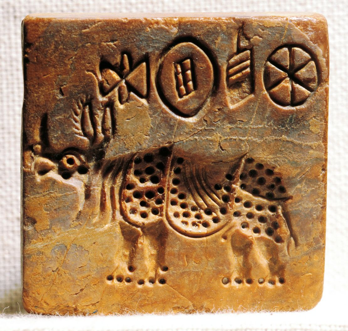 A stone seal inscribed with the Indus Valley script and depicting an Indian rhinoceros, found at Mohenjo-daro.