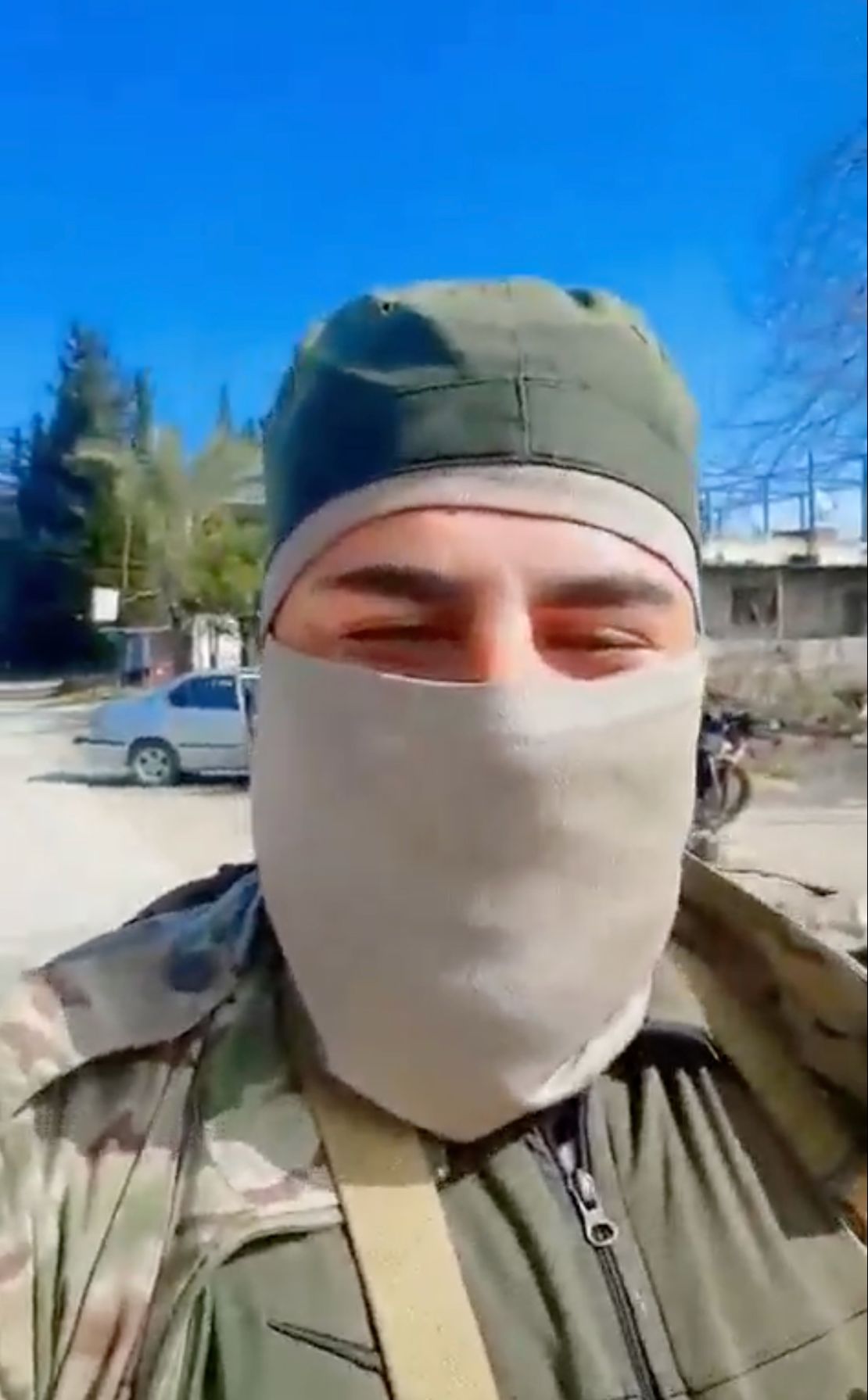 A fighter parades through the streets of Pine village in a screen grab from a video posted on social media.