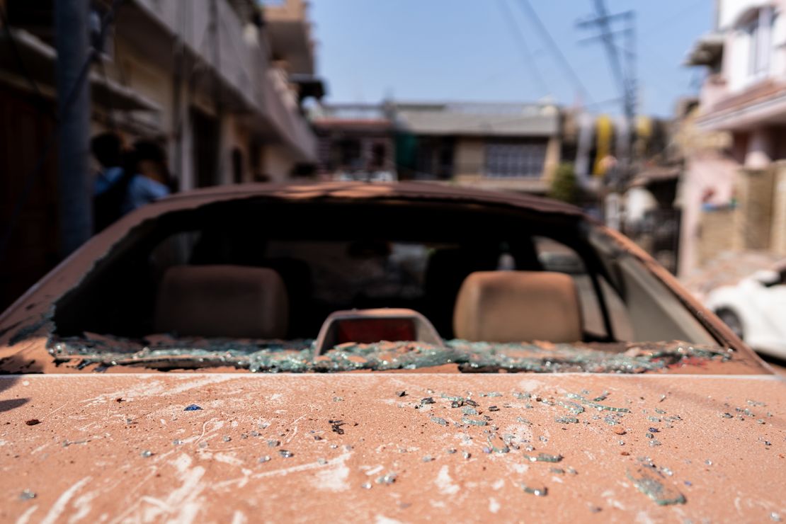 A vehicle damaged by shelling near a residential building in India-administered Kashmir on May 10, 2025.