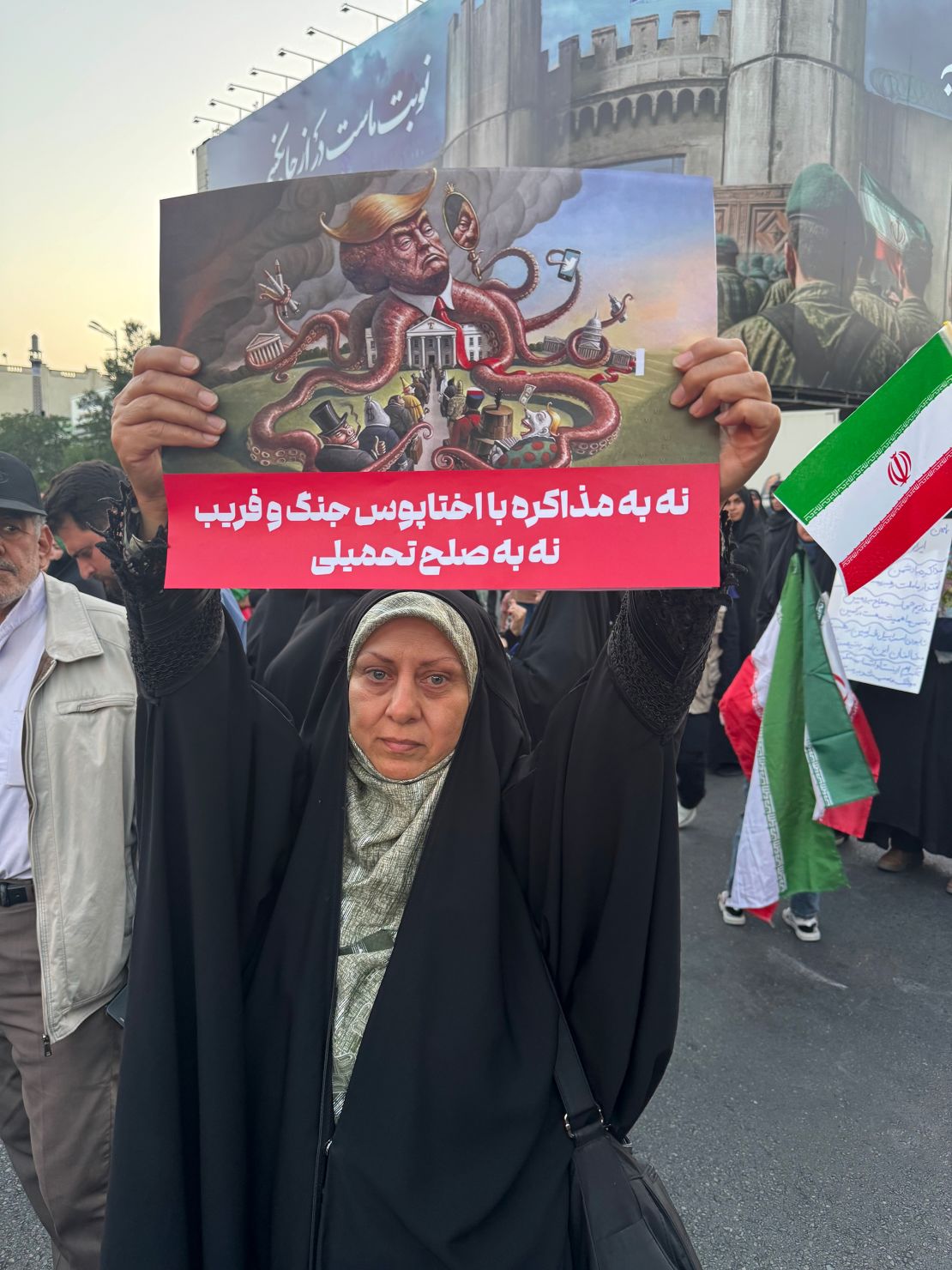 People protest the United States and President Donald Trump in Tehran on Sunday.